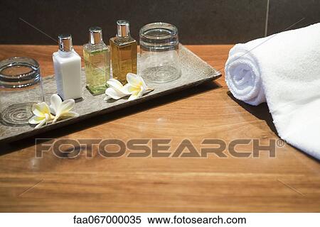 Perfume bottles and frangipani flowers on tray View Large Photo Image Stock Photography - Perfume bottles and frangipani flowers on tray. Fotosearch