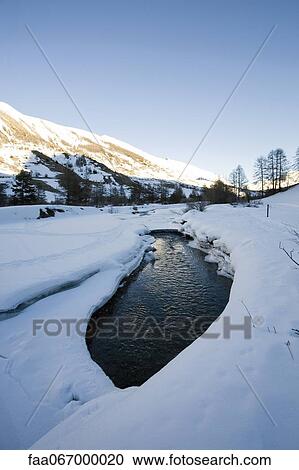 Stock Image - River in snowy landscape. Fotosearch
