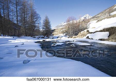 Snow-covered rocks in river in snowy landscape View Large Photo Image Stock Image - Snow-covered rocks in river in snowy landscape. Fotosearch