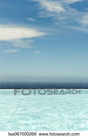 Swimming pool, sea in background View Large Photo Image Stock Photo - Swimming pool, sea in background. Fotosearch