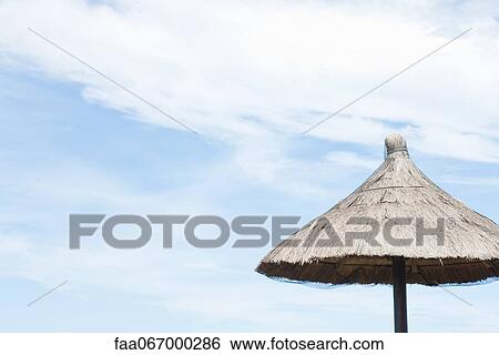 Thatched parasol View Large Photo Image Stock Photograph - Thatched parasol. Fotosearch