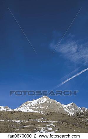 The last of winter snow on mountain peaks View Large Photo Image Stock Image - The last of winter snow on mountain peaks. Fotosearch