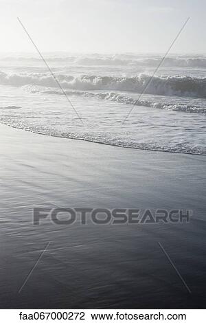 Waves washing onto shore View Large Photo Image Stock Image - Waves washing onto shore. Fotosearch