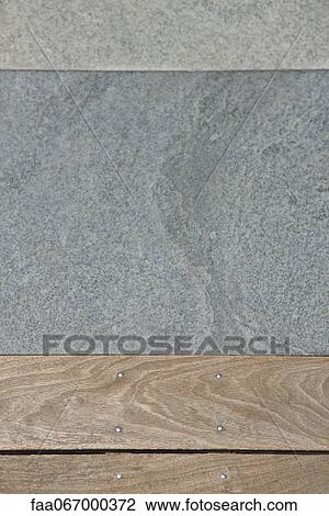 Stock Image - Wooden flooring and paving stone. Fotosearch
