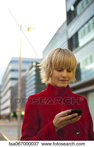 Young woman using cell phone, portrait View Large Photo Image Stock Photo - Young woman using cell phone, portrait. Fotosearch