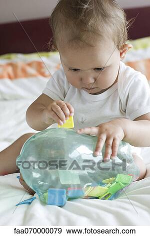 Baby playing with educational toy View Large Photo Image Stock Photo - Baby playing with educational toy. Fotosearch