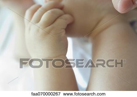 Stock Photo - Baby's hand. Fotosearch