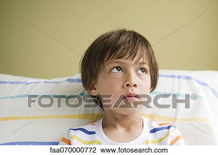 Boy looking up in thought, portrait View Large Photo Image Stock Image - Boy looking up in thought, portrait. Fotosearch