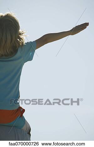 Boy with arms out, rear view View Large Photo Image Stock Photograph - Boy with arms out, rear view. Fotosearch