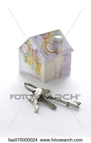 Bunch of keys and model house folded with British pound banknotes View Large Photo Image Picture - Bunch of keys and model house folded with British pound banknotes. Fotosearch