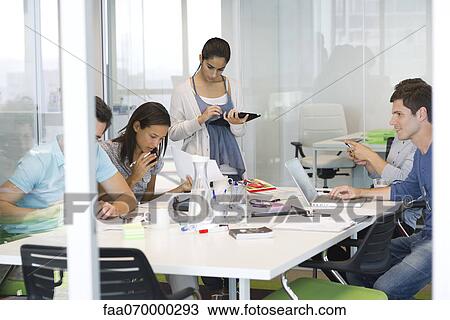 Business associates in casual meeting View Large Photo Image Stock Image - Business associates in casual meeting. Fotosearch