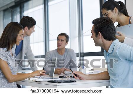 Business associates in meeting View Large Photo Image Picture - Business associates in meeting. Fotosearch