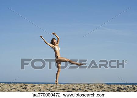 Carefree woman at the beach View Large Photo Image Stock Image - Carefree woman at the beach. Fotosearch