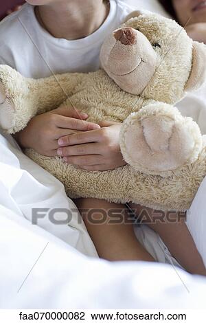 Child hugging teddy bear, cropped View Large Photo Image Stock Image - Child hugging teddy bear, cropped. Fotosearch