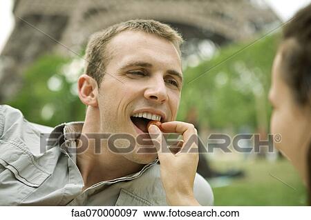 Stock Photo - Couple enjoying romantic picnic. Fotosearch