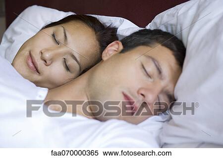 Stock Photography - Couple sleeping. Fotosearch