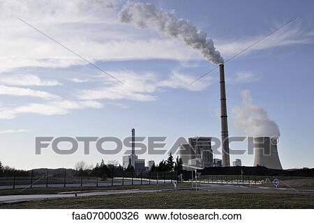 Stock Photograph - Factory, smoke coming out of smokestacks. Fotosearch