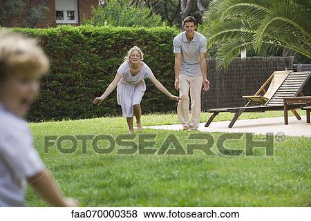 Stock Photo - Family having fun outdoors. Fotosearch