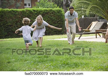 Family having fun together outdoors View Large Photo Image Stock Image - Family having fun together outdoors. Fotosearch