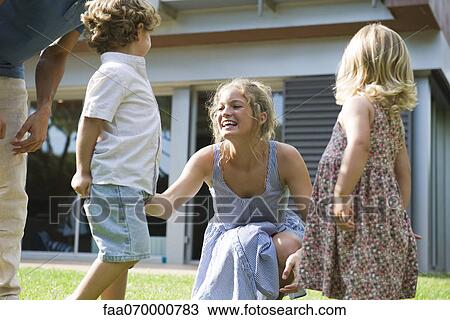 Family having fun together outdoors View Large Photo Image Stock Image - Family having fun together outdoors. Fotosearch