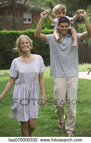 Family walking together outdoors, father carrying son on his shoulders View Large Photo Image Stock Image - Family walking together outdoors, father carrying son on his shoulders. Fotosearch