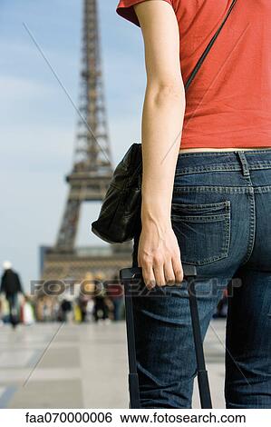 Stock Photograph - Female tourist, cropped rear view. Fotosearch