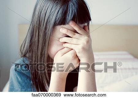 Girl covering face with hands View Large Photo Image Stock Photo - Girl covering face with hands. Fotosearch