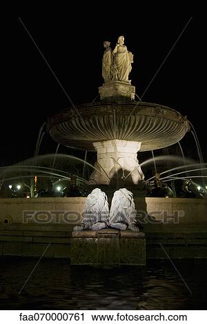 Illuminated fountain at night View Large Photo Image Stock Image - Illuminated fountain at night. Fotosearch
