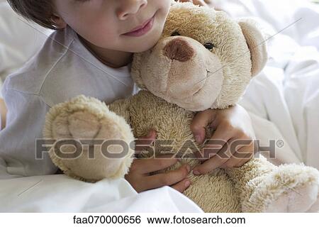Little boy hugging teddy bear, cropped View Large Photo Image Stock Photograph - Little boy hugging teddy bear, cropped. Fotosearch