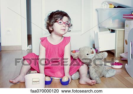 Little girl playing with toys View Large Photo Image Stock Image - Little girl playing with toys. Fotosearch
