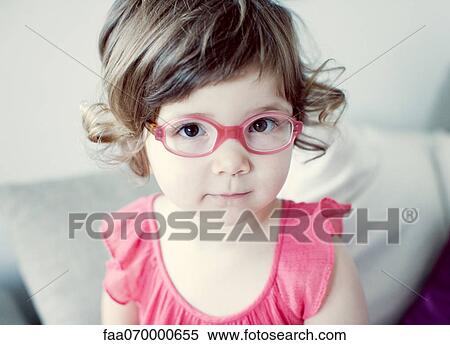 Little girl with glasses, portrait View Large Photo Image Stock Photography - Little girl with glasses, portrait. Fotosearch
