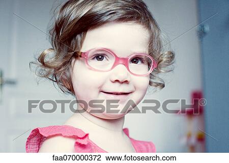 Little girl with glasses smiling, portrait View Large Photo Image Stock Image - Little girl with glasses smiling, portrait. Fotosearch