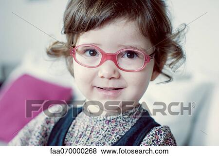 Stock Photo - Little girl with glasses. Fotosearch