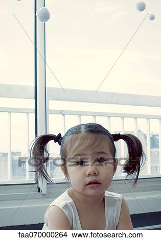 Little girl with pigtails View Large Photo Image Picture - Little girl with pigtails. Fotosearch