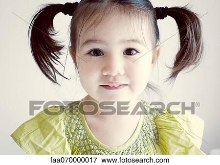 Little girl with pigtails, portrait View Large Photo Image Stock Photo - Little girl with pigtails, portrait. Fotosearch