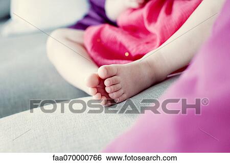 Stock Photograph - Little girl's feet, low section. Fotosearch
