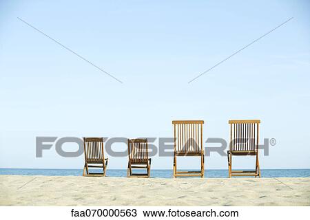 Lounge chairs on beach View Large Photo Image Stock Image - Lounge chairs on beach. Fotosearch