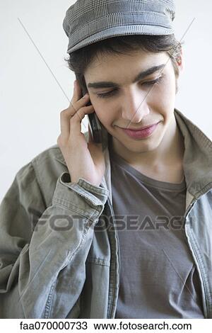 Stock Image - Male talking on cell phone. Fotosearch