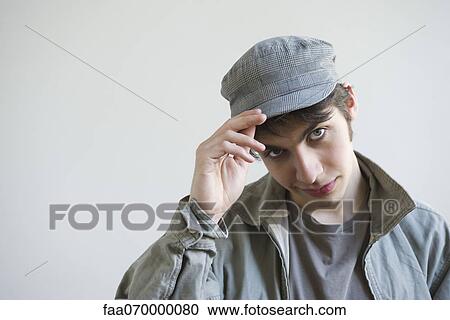 Male tipping hat to camera, portrait View Large Photo Image Stock Image - Male tipping hat to camera, portrait. Fotosearch