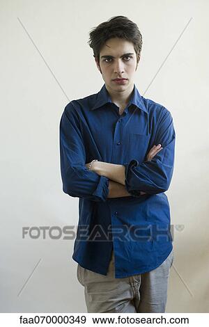 Male with arms folded, portrait View Large Photo Image Stock Photo - Male with arms folded, portrait. Fotosearch