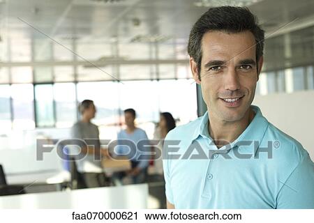 Man in office, portrait View Large Photo Image Stock Image - Man in office, portrait. Fotosearch