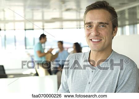 Man in office, portrait View Large Photo Image Stock Photograph - Man in office, portrait. Fotosearch