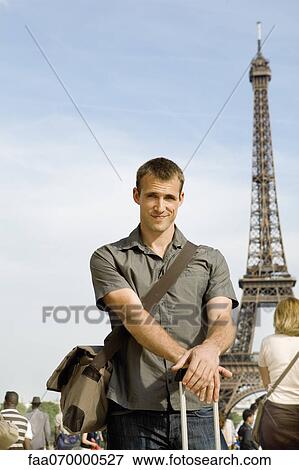 Man posing in front of Eiffel Tower, Paris, France View Large Photo Image Stock Photo - Man posing in front of Eiffel Tower, Paris, France. Fotosearch