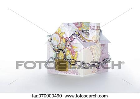 Model house folded with British pound banknotes chained and padlocked View Large Photo Image Stock Image - Model house folded with British pound banknotes chained and padlocked. Fotosearch