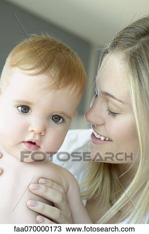 Stock Image - Mother and baby, portrait. Fotosearch