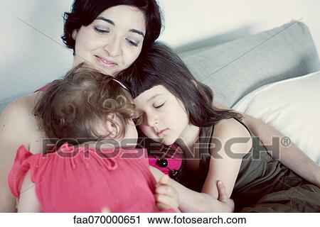 Mother and daughters embracing View Large Photo Image Stock Image - Mother and daughters embracing. Fotosearch