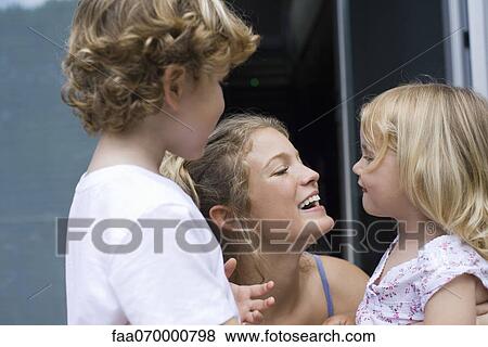 Mother bonding with two young children View Large Photo Image Stock Photo - Mother bonding with two young children. Fotosearch