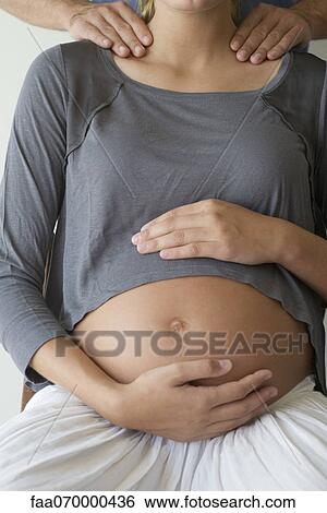 Pregnant woman getting shoulder massage View Large Photo Image Stock Photograph - Pregnant woman getting shoulder massage. Fotosearch