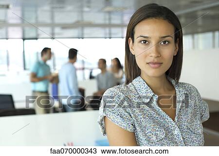 Stock Image - Professional woman in office, portrait. Fotosearch