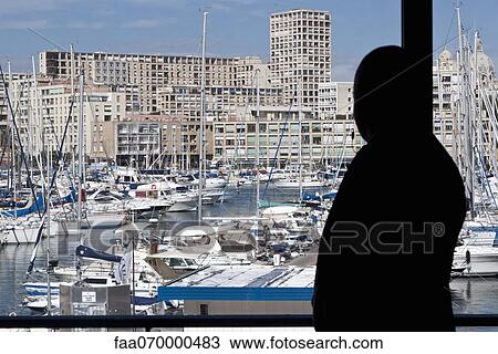 Silhouette of person looking at view of harbor View Large Photo Image Stock Image - Silhouette of person looking at view of harbor. Fotosearch